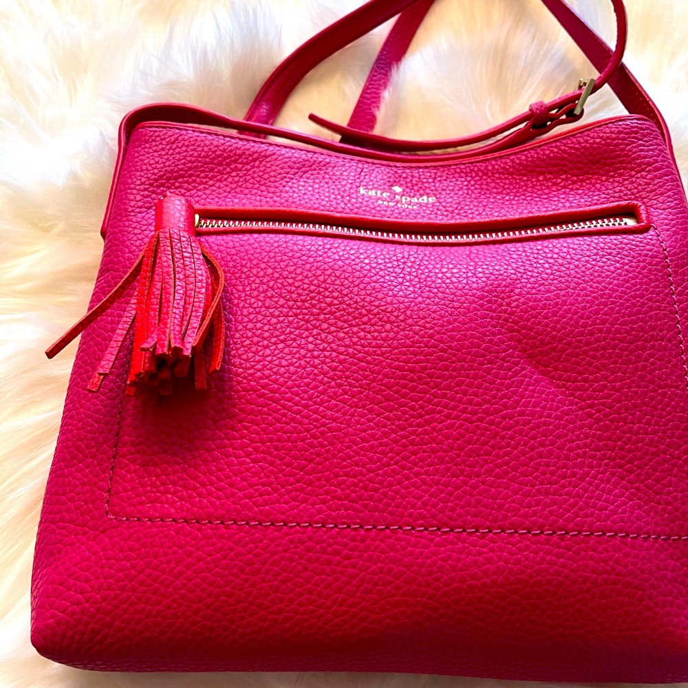 Fuchsia with orange trim crossbody bag.
